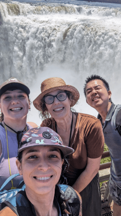 Picture of Ioanna and some friends standing in front of a waterfall